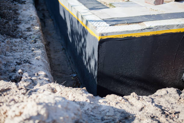 Professional Emergency Waterproofing technician working in Bridgeport, MI